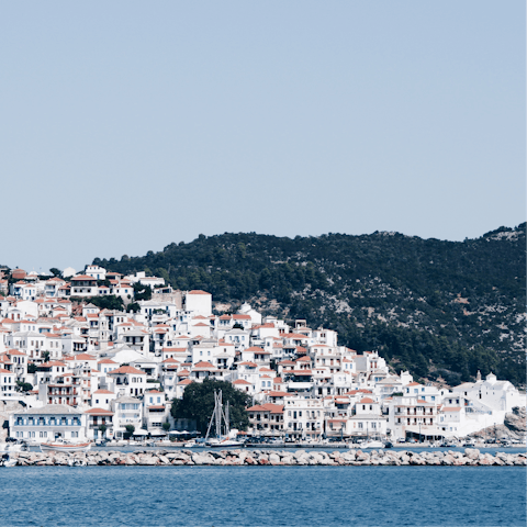 Explore the town of Skopelos, about an hour's drive away