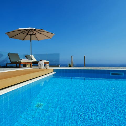 Cool off in the outdoor pool overlooking the sea