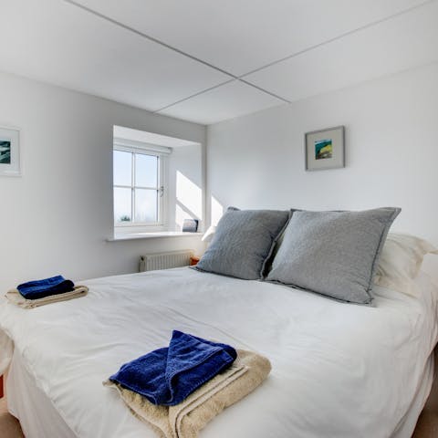 Wake up to sea views in the comfortable main bedroom