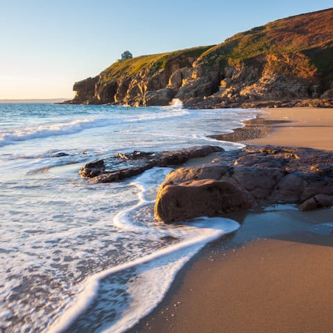 Sink your toes in the sand at Rinsey Cove, a nine-minute stroll from your door