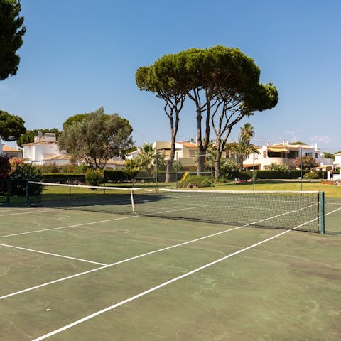 Serve up an ace on the communal tennis court