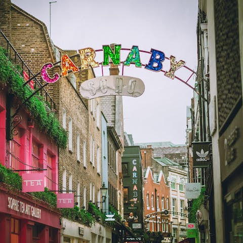 Discover Soho's colourful shops and trendy bars, a twelve-minute stroll from your door