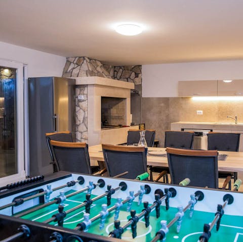 Flex your competitive side playing table football after dinner