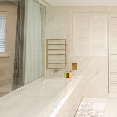 End the day with a soak in the luxurious bathtub