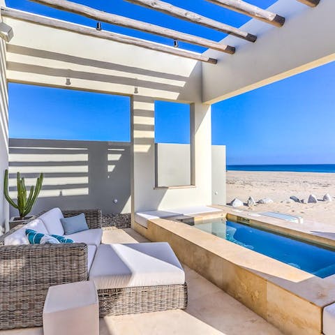 Luxuriate in your private beachfront hot tub