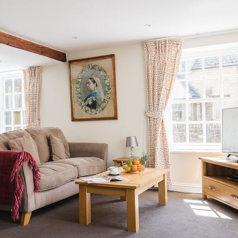 Settle into a cosy living area with traditional sash windows