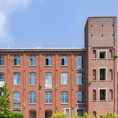 Arrive in style at the grand facade of the former factory where your loft is located