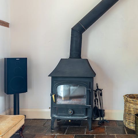 Put some kindling into the log-burner and get cosy besides the crackling flames