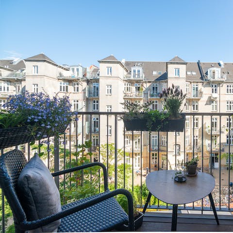 Start your day with a fresh cup of coffee on the master bedroom's secluded balcony