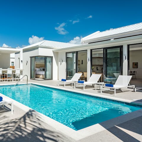 Relax and recline on a poolside lounger or take a dip in the turquoise waters