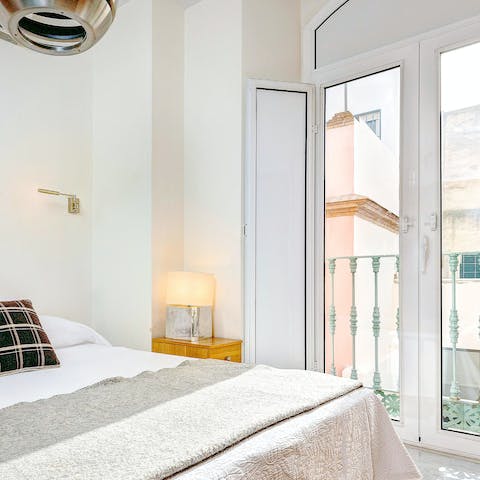 Roll out of bed and throw open the Juliet balcony to let a gentle breeze drift through the apartment