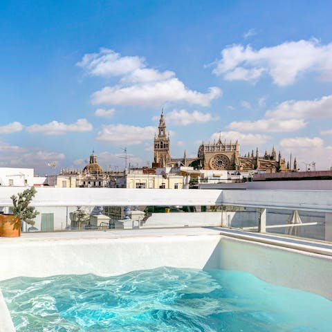 Gaze across the Seville Cathedral from your private plunge pool on hot afternoons