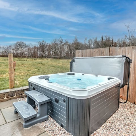 Enjoy a sundowner in the bubbling hot tub