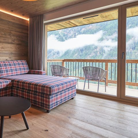 Have your morning coffee on the balcony overlooking Sölden's stunning scenery