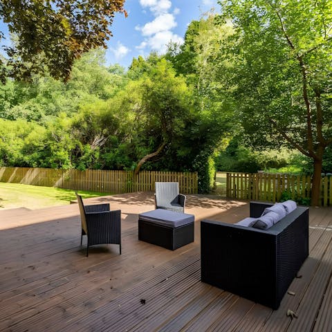 Relax on the terrace in the lush green garden 