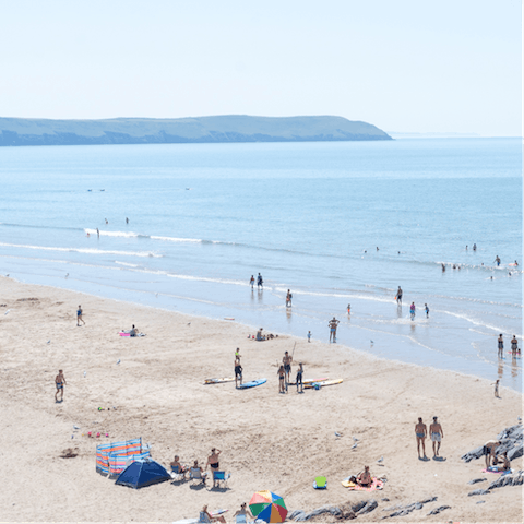 Explore Swansea Beach on the sandy coastline of South Wales, under a ten-minute walk away