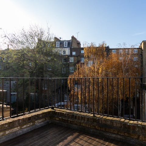 Take in the views over the neighbourhood on the private terrace