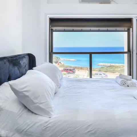 Wake up to sunshine and sea views in the cosy main bedroom