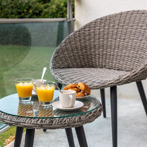 Savour your morning pain au chocolat and orange juice on the balcony