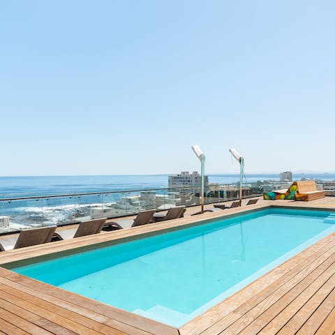 Take a dip in the communal rooftop swimming pool, and admire the views 