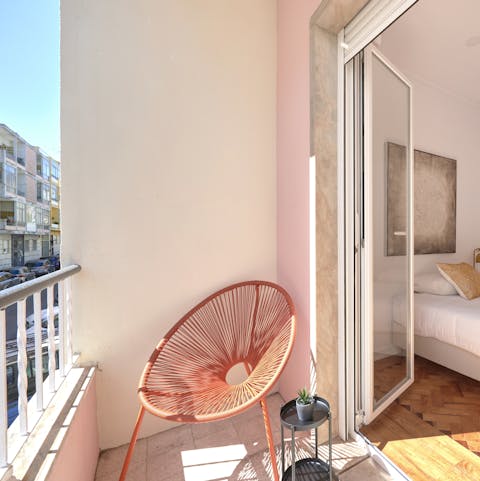 Step out of the second bedroom and onto the sun-baked balcony