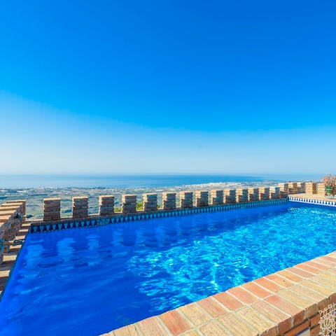 Enjoy a cooling dip in the saltwater pool, overlooking the sea