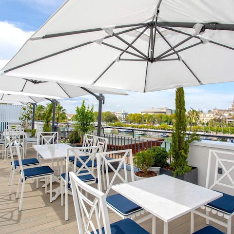 Enjoy a tinto de verano on the communal roof terrace