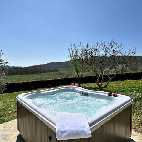 Drink in the countryside views from the peace of the private hot tub