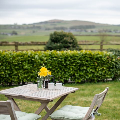 End the evening with a glass of wine in the garden, gazing out at the idyllic scenery as the sun goes down