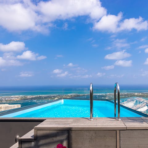 Perch at the end of your infinity pool and enjoy the coastline views