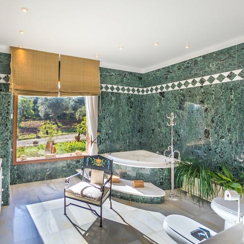 Unwind in the luxurious bathroom with a view