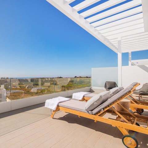 Soak up the Spanish sun from your balcony with views out to sea