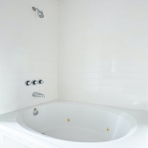 Soothe tired muscles in the jetted bathtub