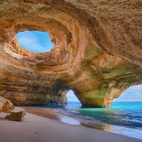 Explore the hidden coves and golden sands of Faro Island Beach