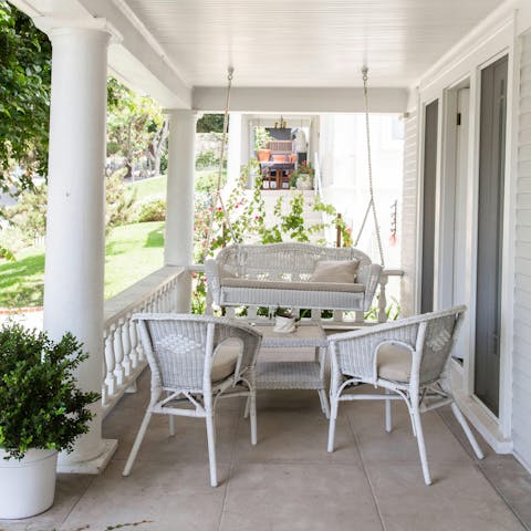 Watch the sunset from the charming porch swing