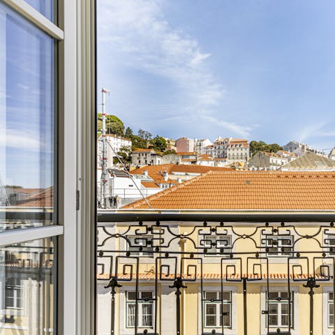Take in the views over the rooftops of Lisbon from the balcony