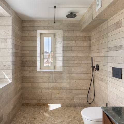 Freshen up in the modern walk-in shower after exploring Baixa
