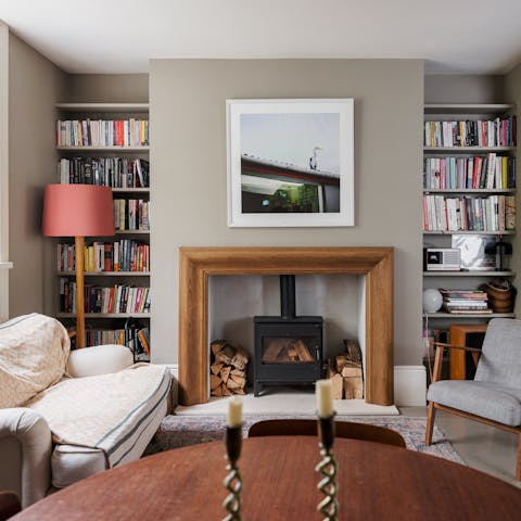 Curl up with a book and a glass of wine in front of the fireplace