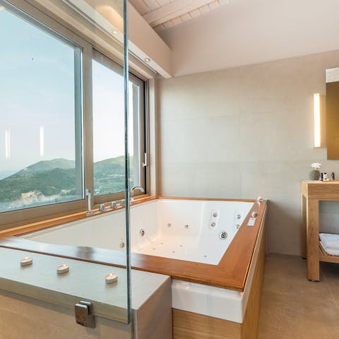 Watch the sunset whilst soaking in the luxurious bath 