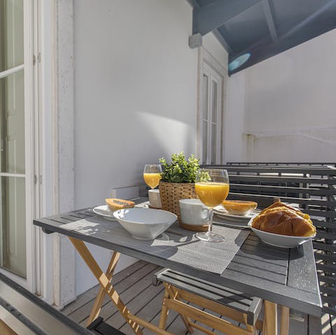 Enjoy breakfast in the sunshine on your balcony