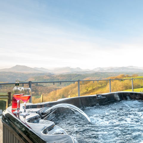 Take in the glorious views over Snowdonia from the hot tub