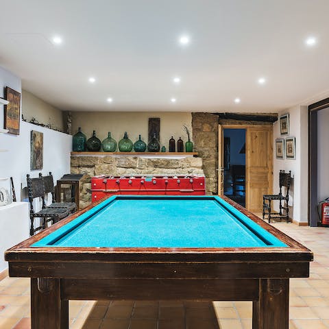 Enjoy a game of pool or table football in the games room