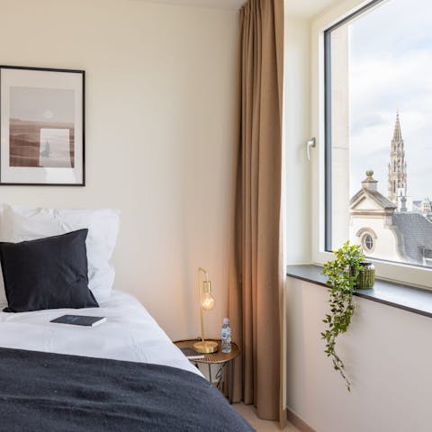 Wake up to city views, including Grand Place's City Hall