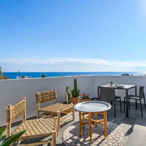 Gaze out on the Aegean Sea from the balcony