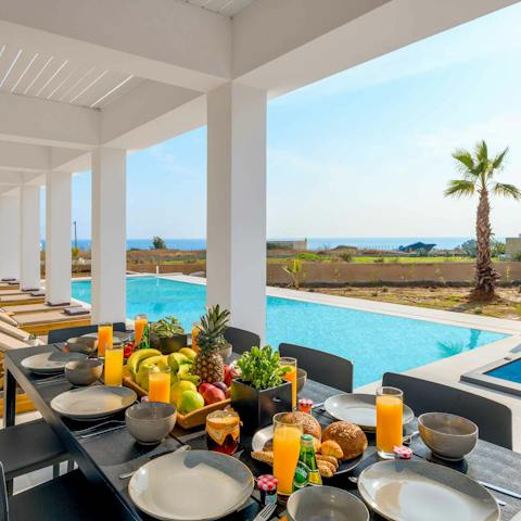 Drink or dine alfresco on the covered poolside terrace