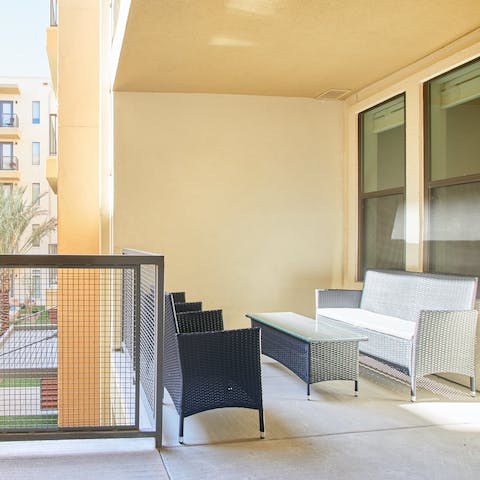 Head out onto the apartment's private balcony with a new book