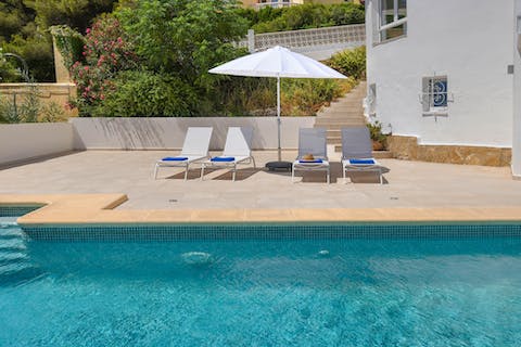 Soak up the Spanish sun beside the private pool