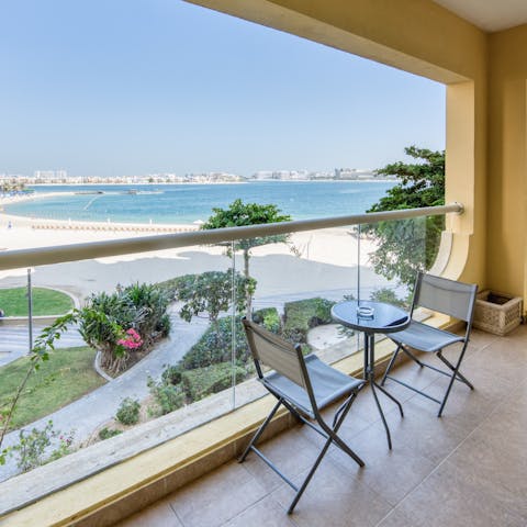 Sip your morning coffee out on your balcony overlooking the Arabian Gulf