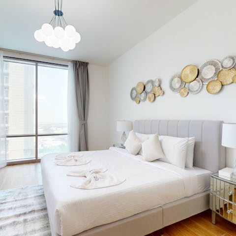 Wake up to city views from the comfortable king-sized bed