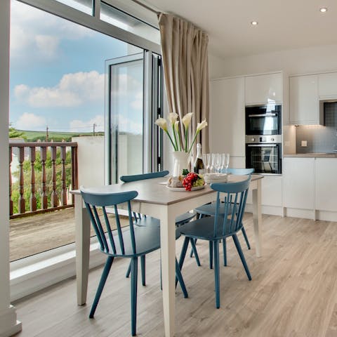 Gather around the cheerful dining table for dinners at home, keeping the patio doors open to let the breeze in